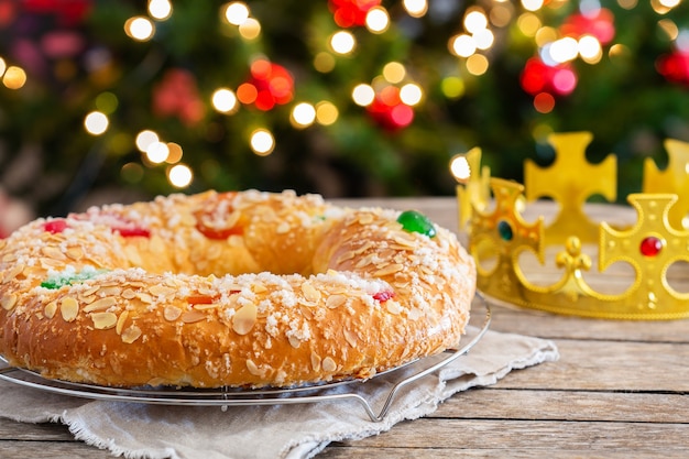 Traditional spanish epiphany cake roscon de reyes with festive decorations