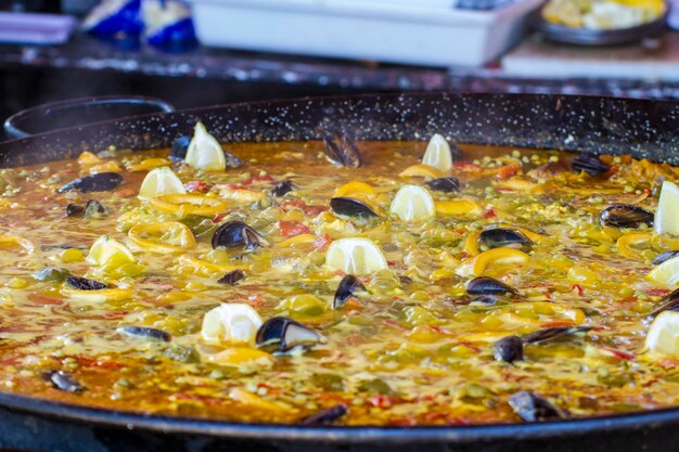 Traditional Spanish paella, seafood and rice dish made ​​with wood fire