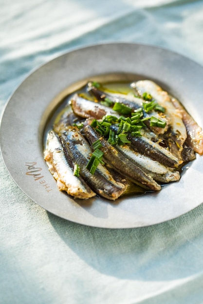 Traditional Spanish pintxos of Cantabrian anchovies in olive oil