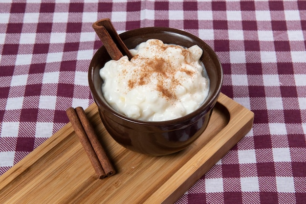 Traditional sweet from the Brazilian June festivals made of white corn with coconut and condensed milk and sprinkled with cinnamon