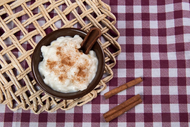 Traditional sweet from the Brazilian June festivals made of white corn with coconut and condensed milk and sprinkled with cinnamon