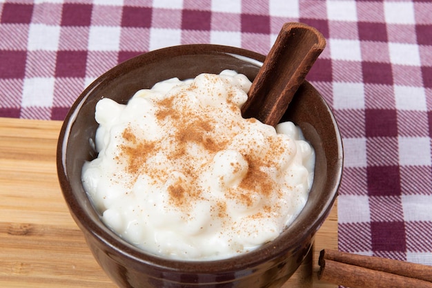 traditional sweet from the brazilian june festivals made of white corn with coconut and condensed milk and sprinkled with cinnamon