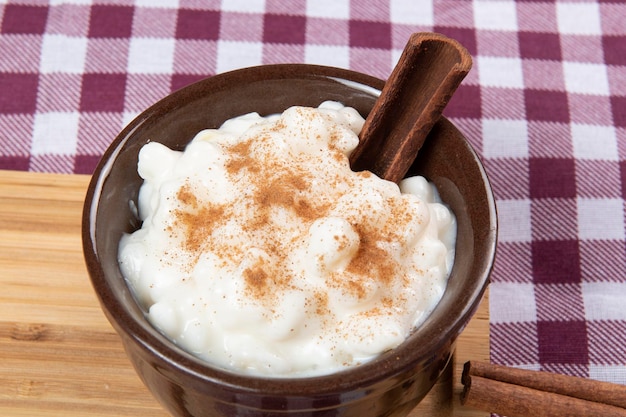 Traditional sweet from the Brazilian June festivals made of white corn with coconut and condensed milk and sprinkled with cinnamon