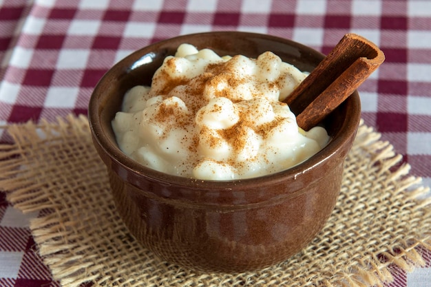 Traditional sweet from the Brazilian June festivals made of white corn with coconut and condensed milk and sprinkled with cinnamon