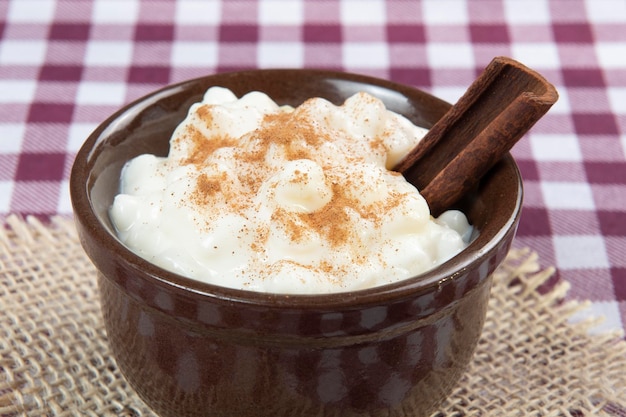 Traditional sweet from the Brazilian June festivals made of white corn with coconut and condensed milk and sprinkled with cinnamon