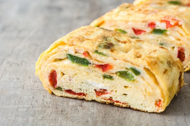 Traditional tamagoyaki Japanese omelette on wooden surface