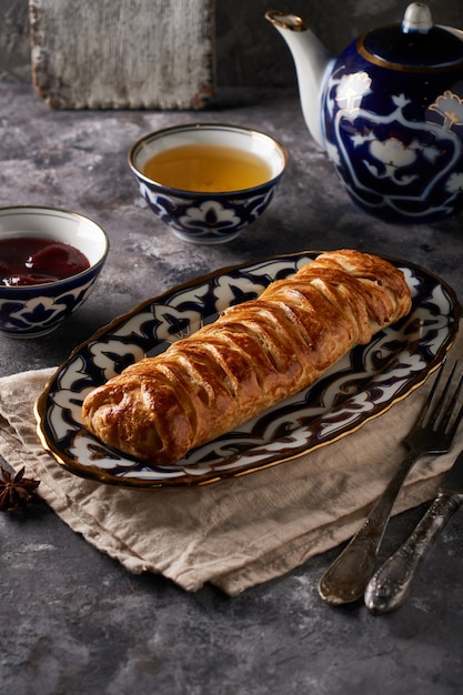 Traditional tasty apple pie, strudel, served in a beautiful oriental plate