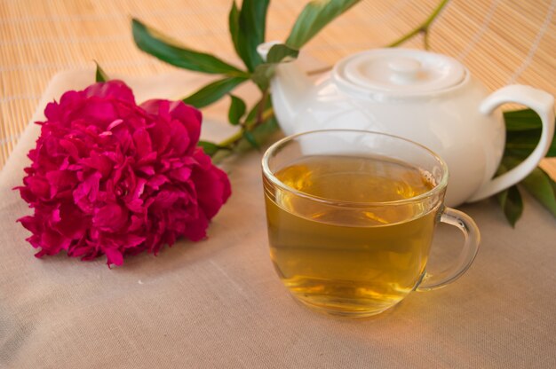 Traditional tea ceremony. Brewed green  in teapot and Cup