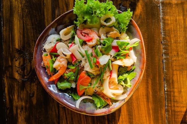 Traditional Thai cuisine Funchosa salad with seafood top view