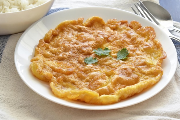 Traditional Thai omelette on a white plate