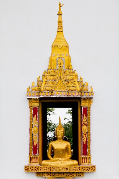 Traditional Thai style Buddhist church window on white wall