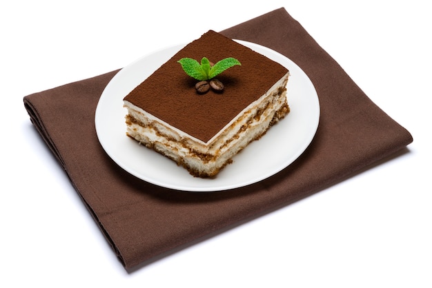 Traditional tiramisu dessert on a ceramic plate