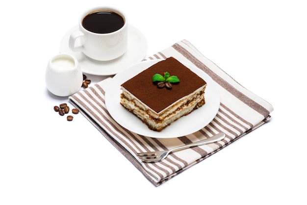 Traditional tiramisu dessert on a white plate