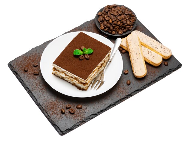 Traditional tiramisu dessert on a white plate