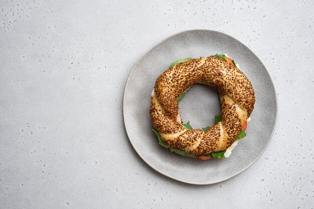 Traditional Turkish bagel simit breakfast on gray concrete table background top view flat lay with copy space for text