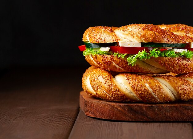 Traditional Turkish bagel simit, breakfast, on a wooden table, rustic, horizontal, no people,. High quality photo