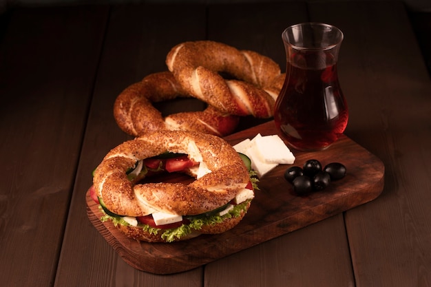 Traditional turkish bagel simit breakfast on a wooden table rustic 