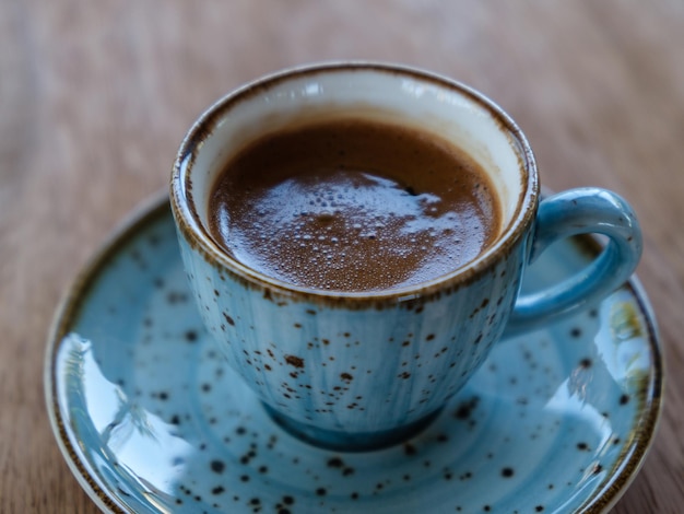 Traditional Turkish coffee in a blue cup