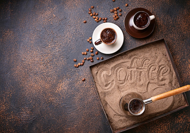 Traditional turkish coffee prepared on hot sand