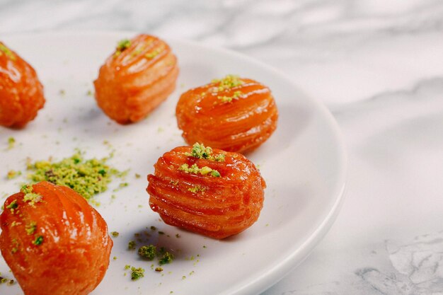 Traditional turkish dessert baklava with cashew walnuts Homemade baklava with nuts and honey