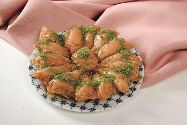 Photo traditional turkish dessert baklava with cashew, walnuts. homemade baklava with nuts and honey.