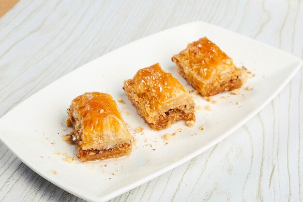 Traditional turkish dessert baklava with cashew walnuts Homemade baklava with nuts and honey