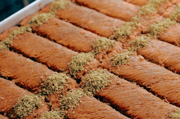 Photo traditional turkish dessert baklava with cashew, walnuts. homemade baklava with nuts and honey.