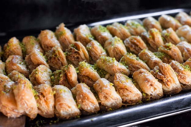 Traditional Turkish dessert - baklava with pistachios on a tray