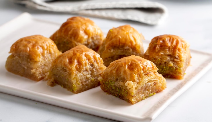 Photo traditional turkish dessert; handmade walnut baklava. turkish name; cevizli baklava