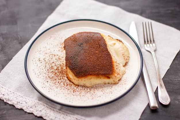 Traditional Turkish dessert Kazandibi with ground cinnamon