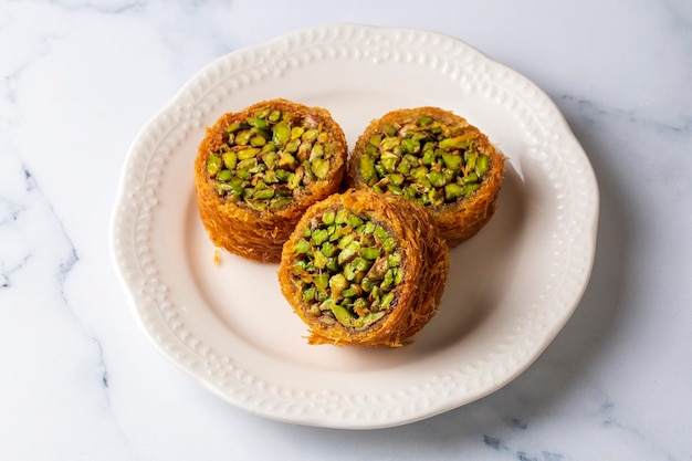 Traditional Turkish desserts; Kadaif stuffed with pistachios. Turkish name; Kadayif dolmasi or dolma kadayif