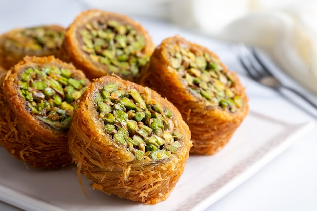 Traditional Turkish desserts; Kadaif stuffed with pistachios. Turkish name; Kadayif dolmasi or dolma kadayif