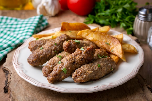 Traditional Turkish food; dry meatballs or inegöl meatballs with potatoes (Turkish name; Kuru kofte or anne koftesi)