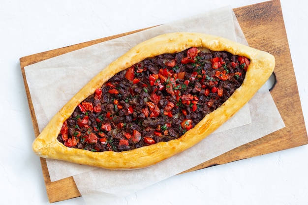 Traditional Turkish pide with meat. Turkish cuisine. National food.