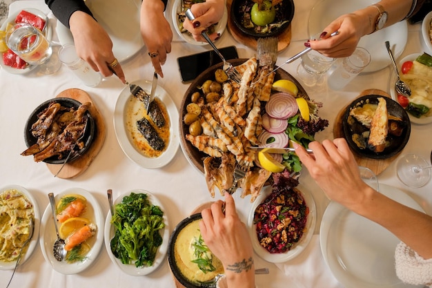 Traditional Turkish seafood restaurant dinner table with friends.