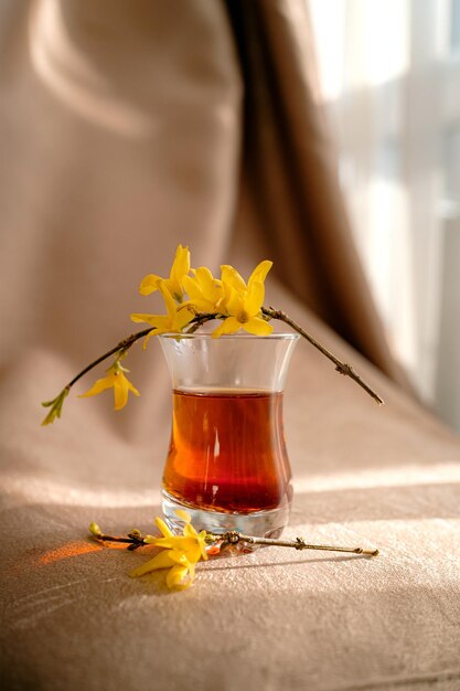 Traditional turkish tea cup on fabric background