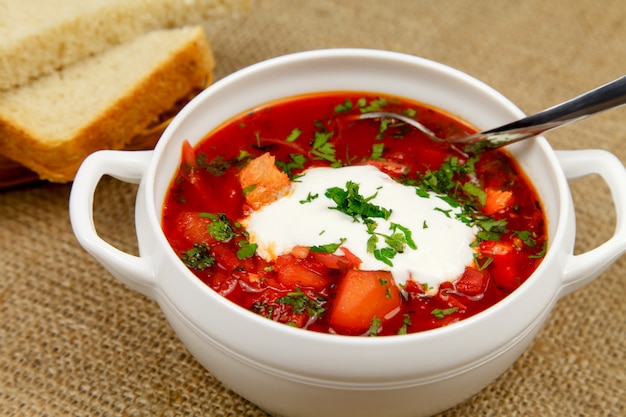 Traditional Ukrainian borsch with sour cream