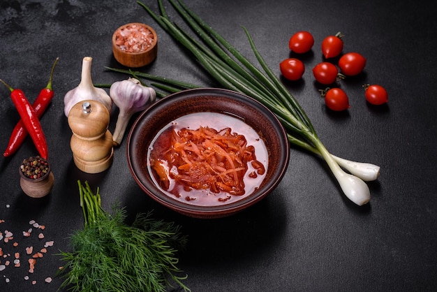 Traditional Ukrainian borscht with beets tomatoes garlic spices and herbs Ukrainian dish traditional food