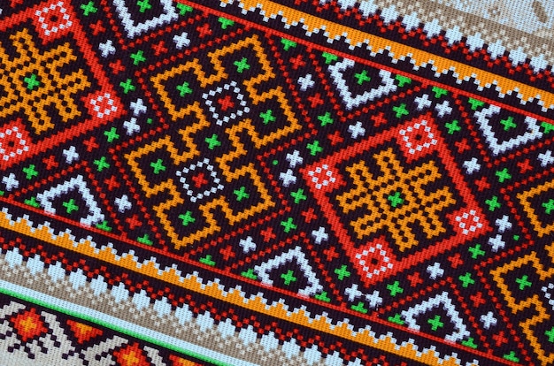 Photo traditional ukrainian folk art knitted embroidery pattern on textile fabric