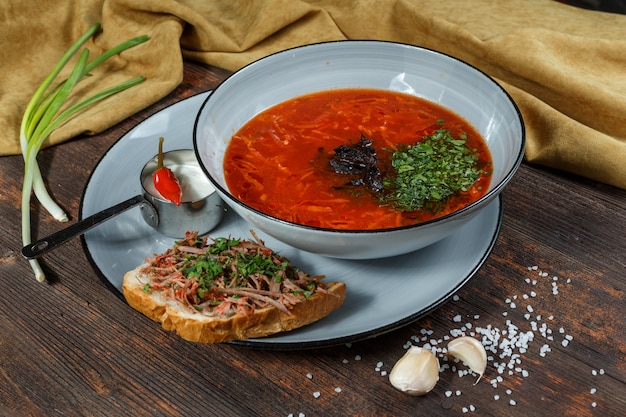 Traditional Ukrainian Russian borsch with white beans on the bowl. Flat lay. Top view