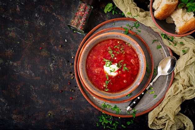 Traditional Ukrainian Russian borscht with beef on the bowl. Top view