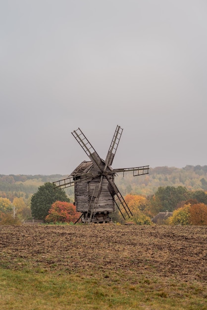 Traditional Ukrainian wooden mills in the field