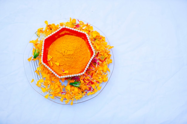 Traditional wedding ceremony in Hinduism Turmeric in plate for haldi ceremony