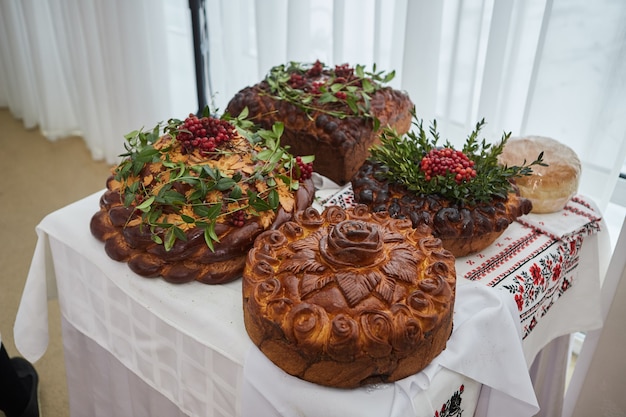 Traditional wedding Ukrainian bread Korovai with flowers