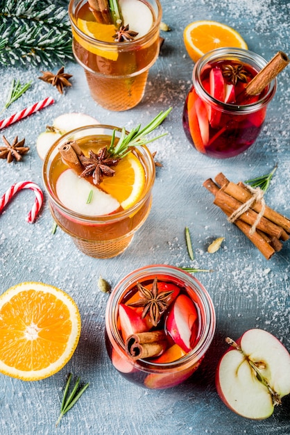 Traditional winter drinks, white and red mulled wine cocktail,  with white and red wine
