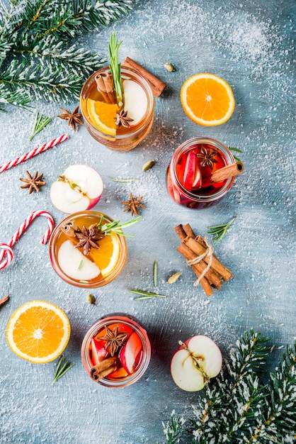 Traditional winter drinks, white and red mulled wine cocktail,  with white and red wine