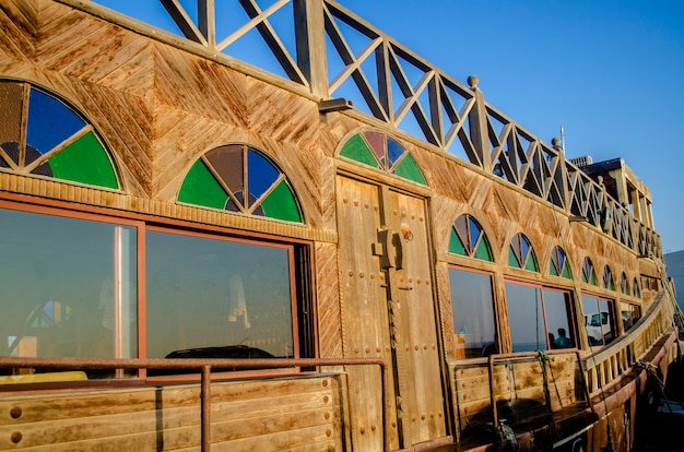 Traditional wooden dhow cruise across the Creek with a view of skyline of Wakra