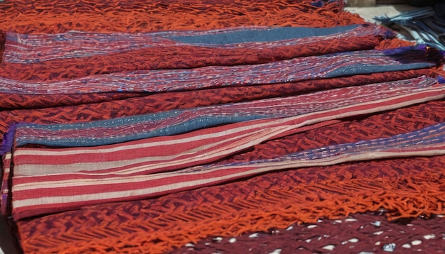 Photo traditional woven tais fabric scarves in dili souvenir market east timor leste