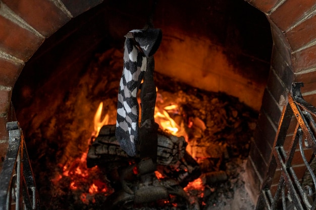 Traditional xmas epiphany socks hanging on fireplace