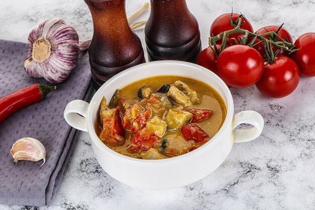 Traditional yellow Thai curry with chicken